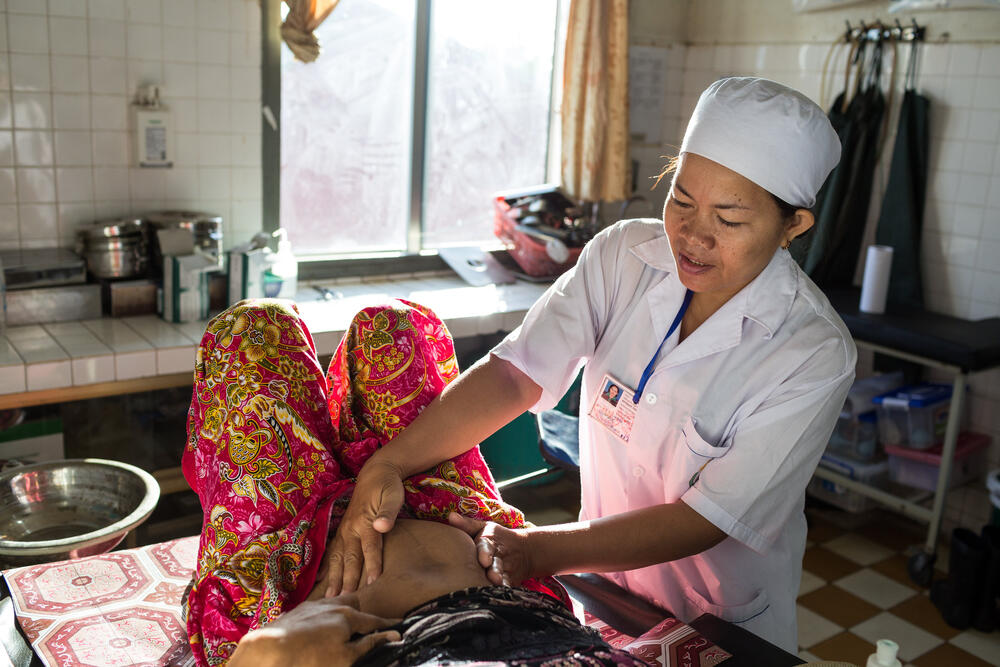 Health professional checking a pregnant woman
