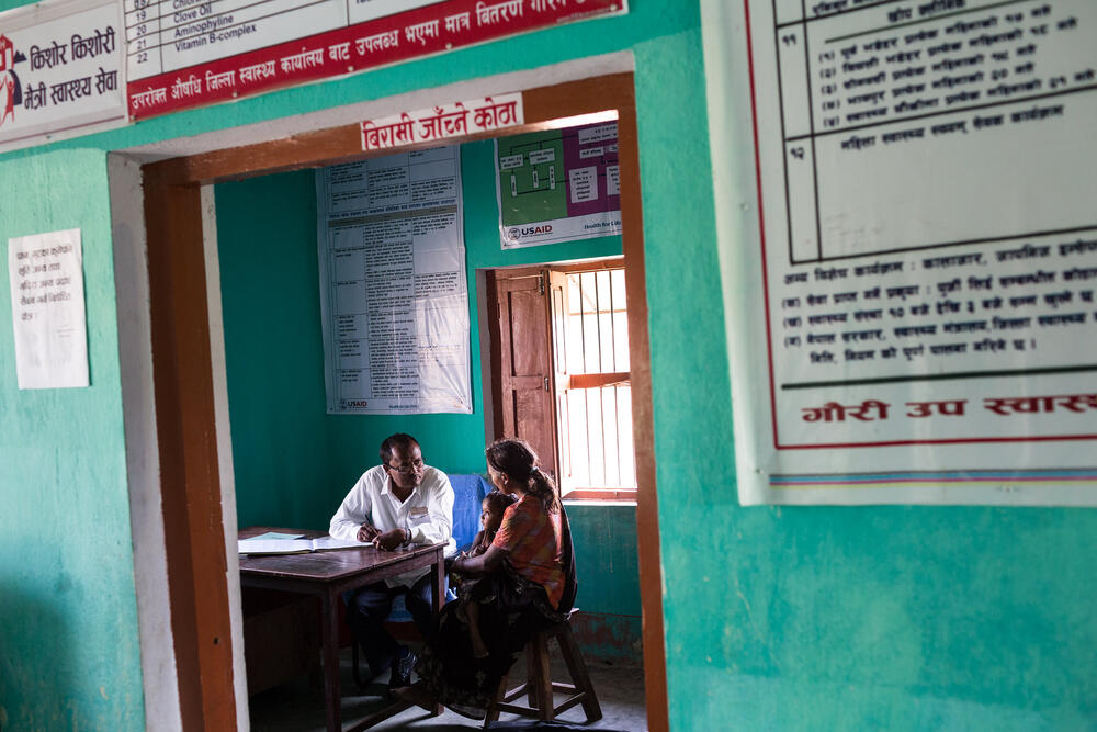 Patient in a consultation with a health professional in a simple room