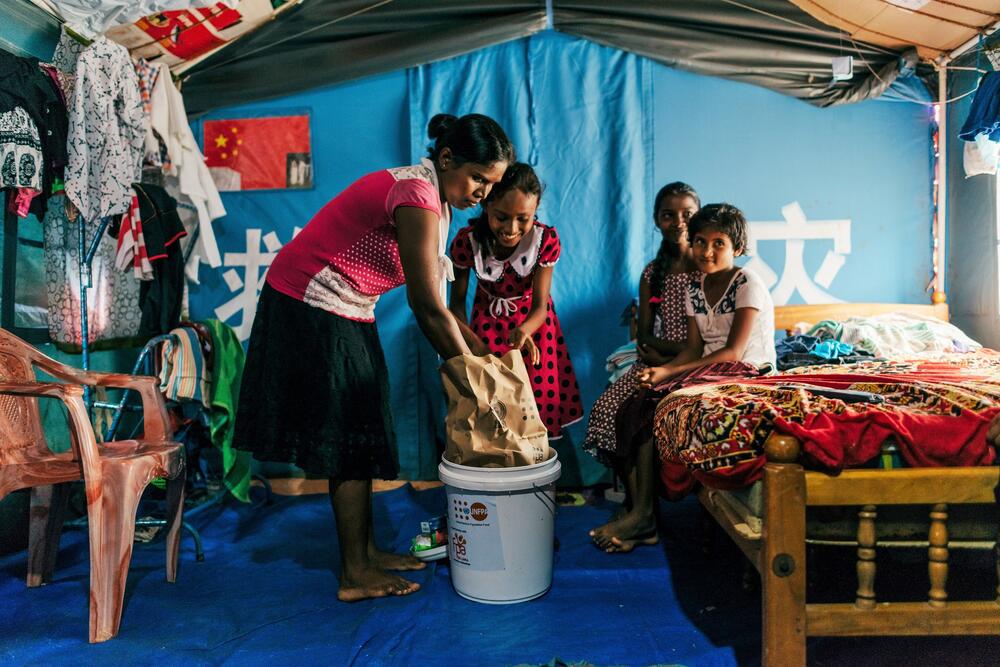 Young girls checking one of the UNFPA kits for humanitarian responses