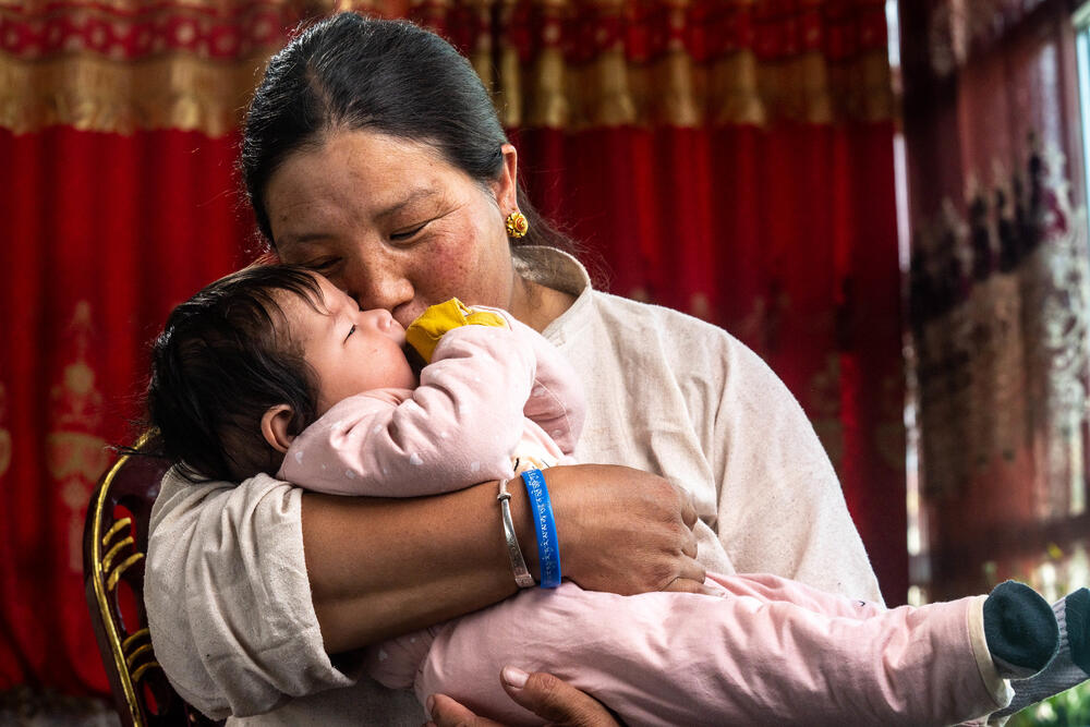 Mother holding her baby