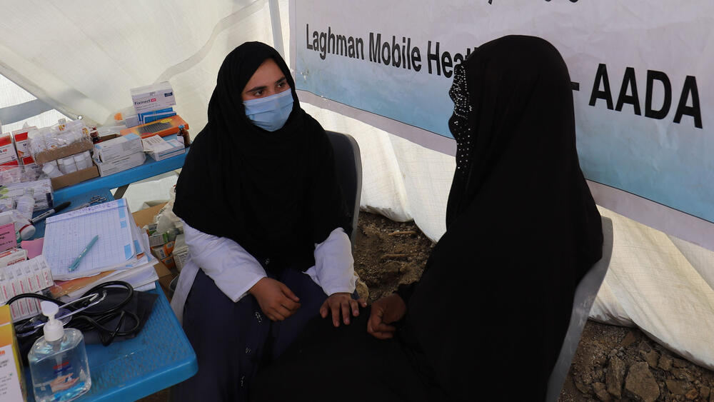 A photo of two women, a psychosocial counsellor and a survivor from the earthquake