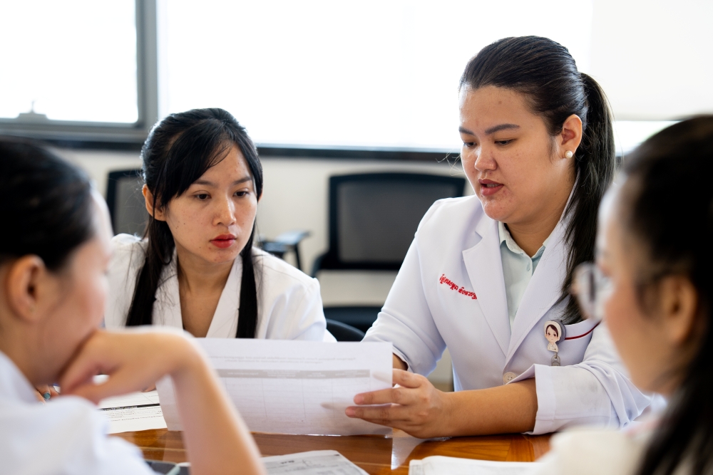 Health professional analysing a document
