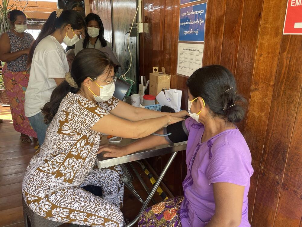 A woman affected by the earthquake in Myanmar receives primary healthcare at a UNFPA-supported mobile clinic in Mandalay,  30 March 2025 (Photo: AFXB Myanmar/UNFPA Myanmar)