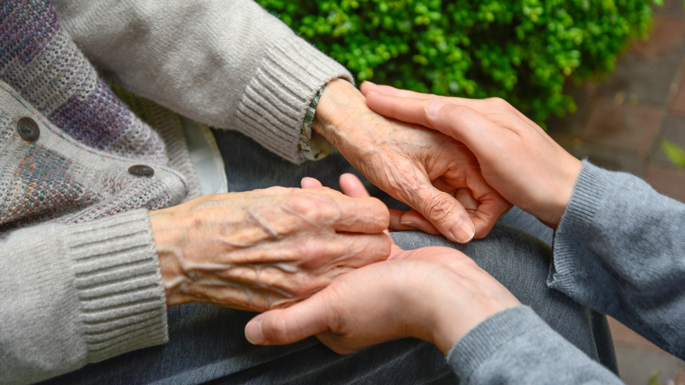 Two hands holding together.