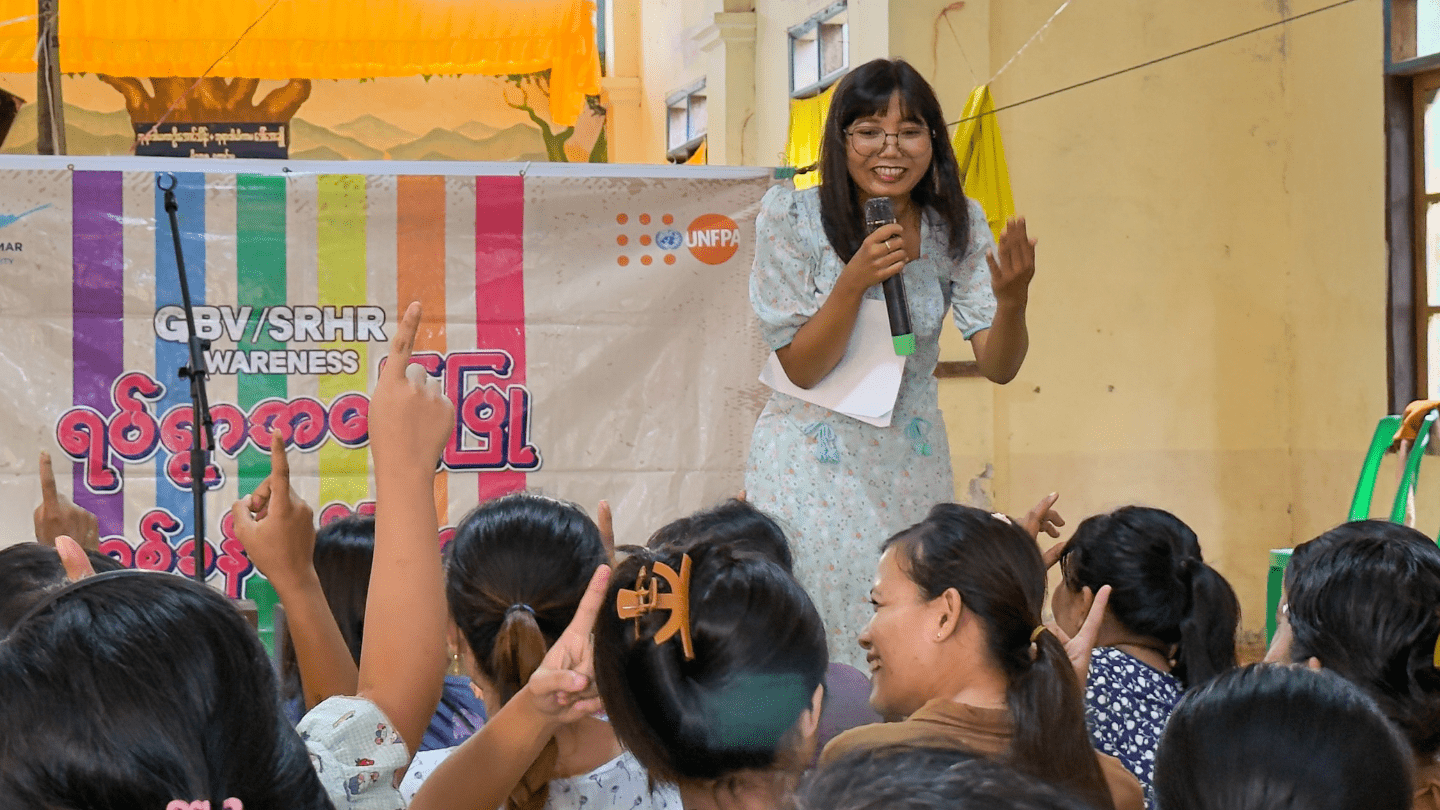 Community women actively participate in a dialogue with youth performers in Mon State, Myanmar.